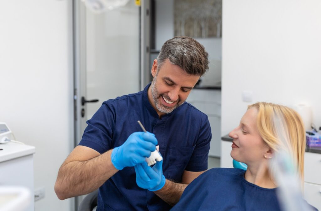 Dentist explaining dental crown aftercare to a patient