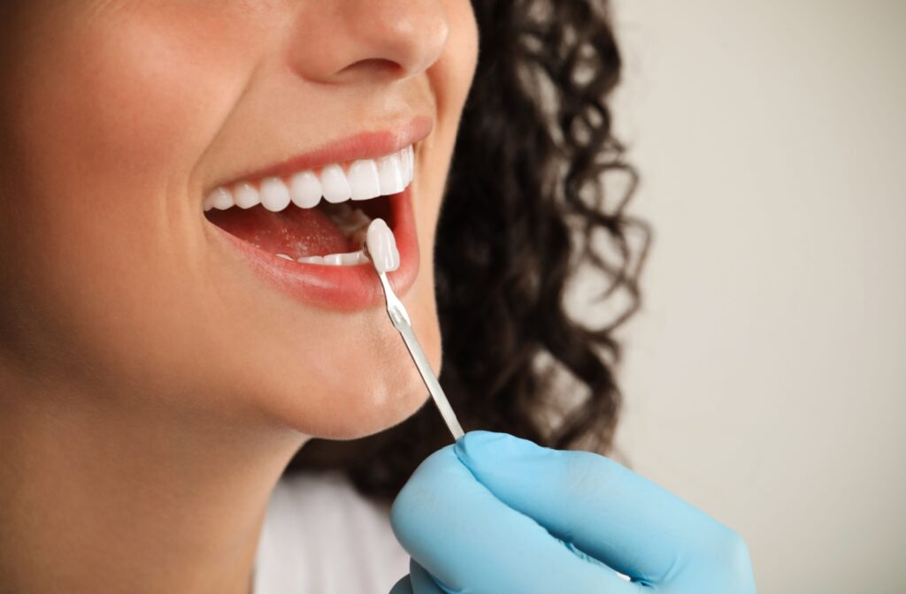 Happy patient smiling after receiving a dental crown
